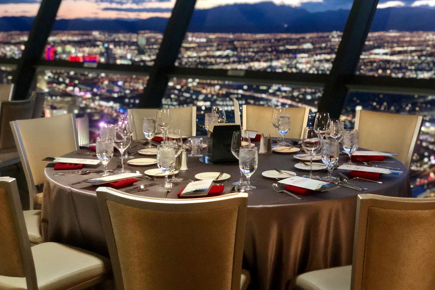 The STRAT Tower observation deck table set for a private dinner with a view of Las Vegas valley